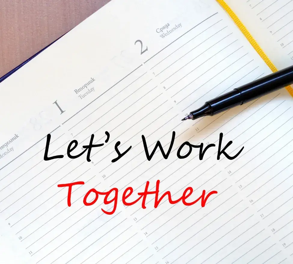 Picture shows an open diary and a pen the text reads 'Let's Work Together' referring to the final stage of onboarding with a Virtual Assistant, setting priorities and work.